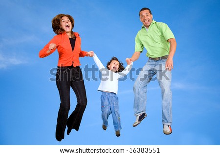 Excited family jumping on the clear skies