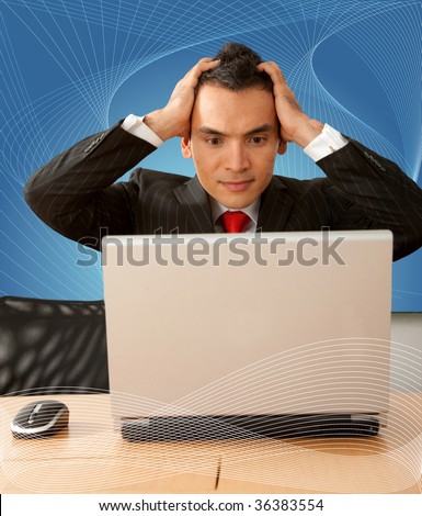 Business man with a laptop looking stressed