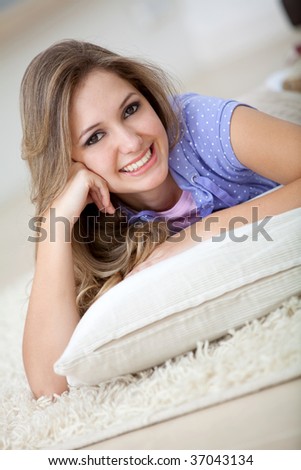 Beautiful woman lying on the floor smiling