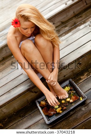Beautiful woman washing her feet -  beauty concepts