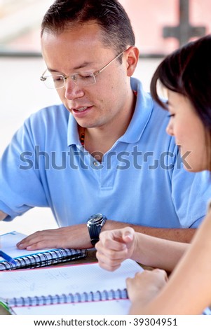 Man and woman portrait studying with notebooks