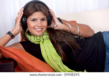 Woman portrait with headphones listening to music