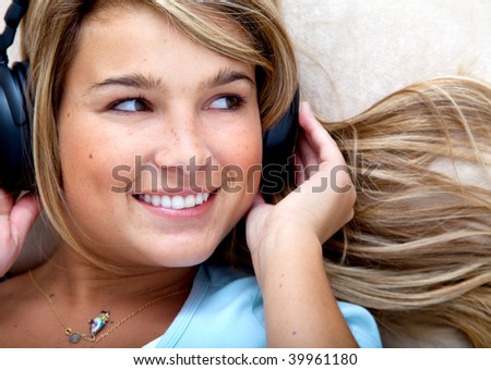 Beautiful woman portrait with headphones smiling indoors