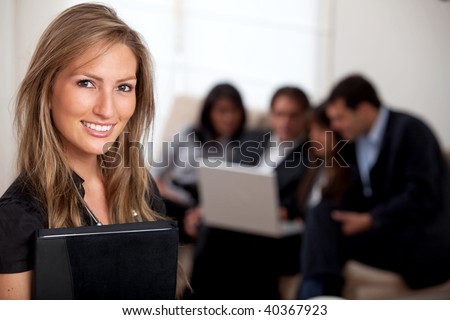 Business woman portrait holding a portfolio and smiling