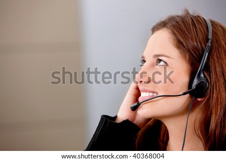 Customer support operator at an office smiling