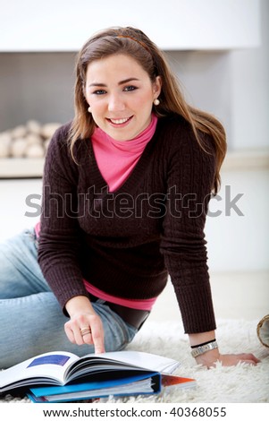Female portrait studying at home and smiling
