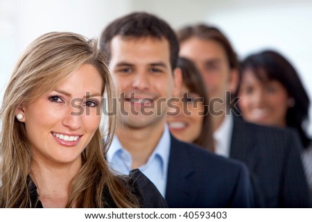business team in an row - smiling in an office