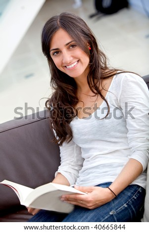 Beautiful woman portrait smiling and studying at home