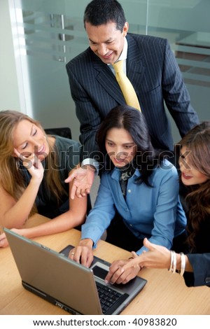 small business team in a meeting on a laptop computer at the office