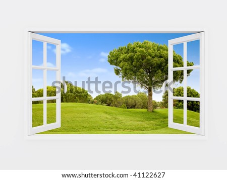 Beautiful view over a window of a green field with a blue sky