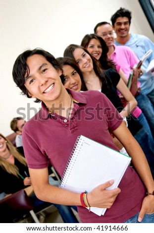 Group of young students at the university smiling
