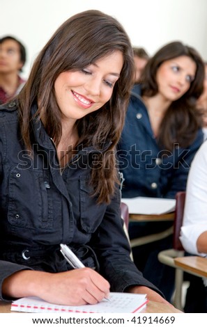 Young people studying at the university smiling