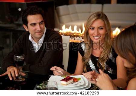 Group of friends at dinner in an elegant restaurant