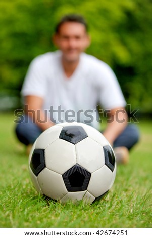 Man with a soccer ball at the park