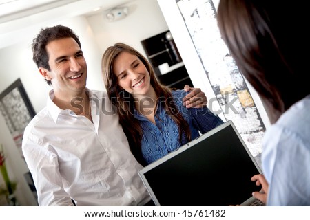 Happy customers at the reception of a hotel