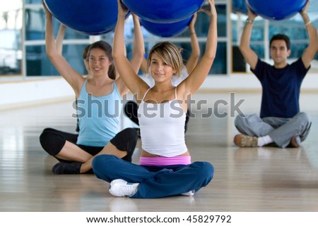 Group of people at the gym in a pilates class