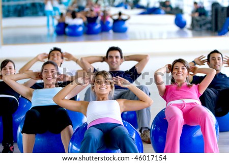 group of people at the gym in a pilates class