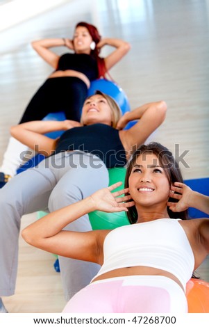 group people in a pilates class at the gym