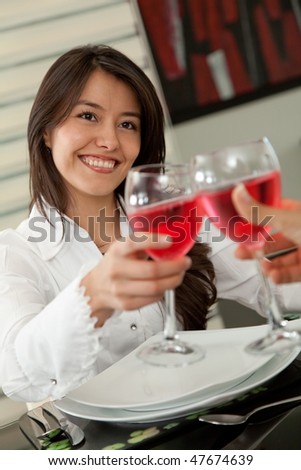 Corporate woman at a restaurant having a business lunch