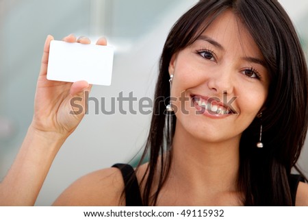 Woman displaying a personal business card at the office
