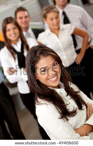 Business woman with a group at the office