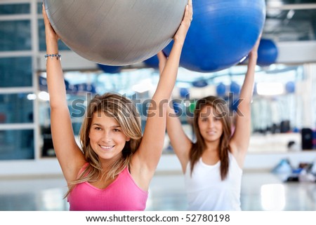 group of  women in a pilates class at the gym