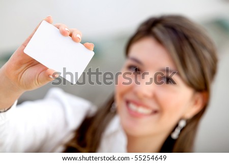 Woman displaying a personal business card at the office