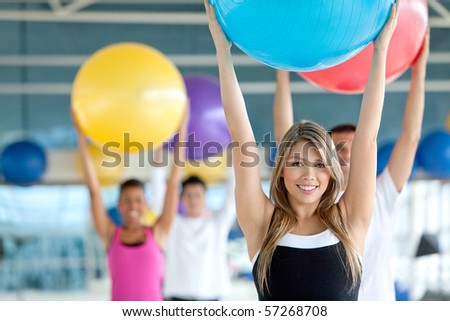 Group of people in a pilates class at the gym