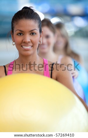 Group of women in a pilates class at the gym
