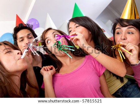 Group of people at a birthday party having fun