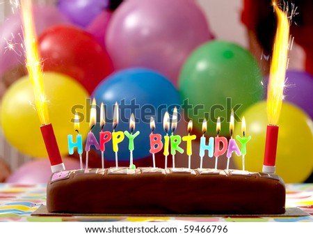 http://image.shutterstock.com/display_pic_with_logo/1294/1294,1282409730,1/stock-photo-birthday-cake-with-candles-lit-up-and-balloons-on-the-background-59466796.jpg