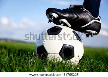 Football or soccer ball at the kickoff of a game outdoors Football or soccer ball at the kickoff of a game outdoors