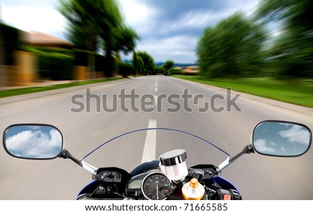 Motorcycle going at high speed on a straight road