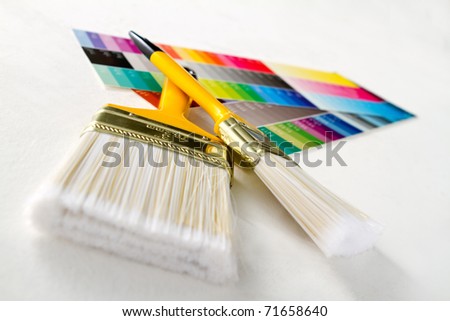 Paint brushes with color guide - isolated over white