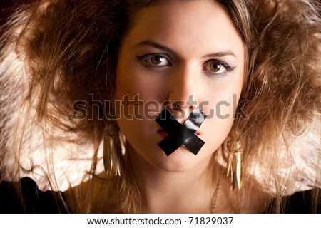 Silenced eccentric woman with tape over her mouth