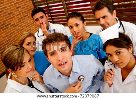 Patient with a group of doctors around