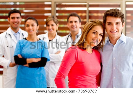 Healthy patients at the hospital with doctors on the background