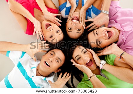 Group of people lying on the floor making surprised faces