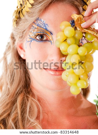 Beautiful Greek goddess holding a bunch of grapes - isolated