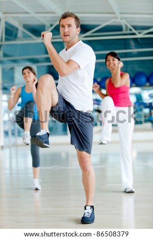 Group of gym people in an aerobics class