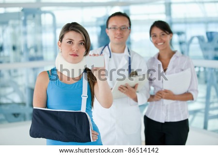 Injured insured woman displaying an insurance card