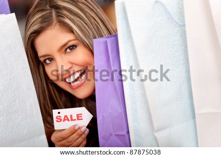 Happy woman enjoying shopping on sale season