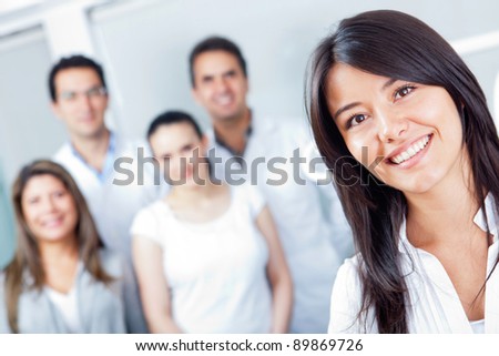 Woman smiling at the hospital with medical staff