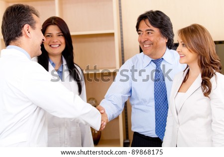 Business man handshaking with a doctor for making a successful sale