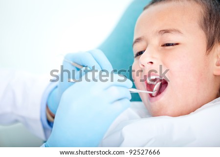 Boy visiting the dentist for cleaning and checkup