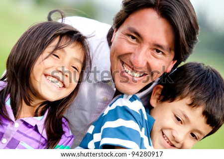 Single parent family portrait looking very happy and smiling