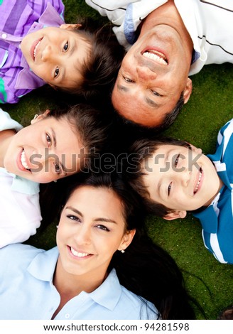 Family portrait lying on the floor with their heads together