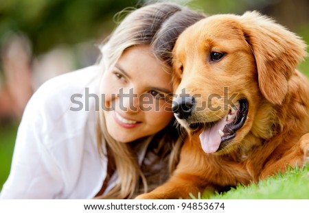 Portrait Of A Woman With Her Beautiful Dog Lying Outdoors
