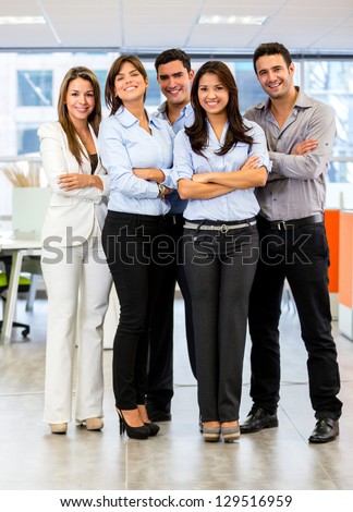 Confident Business Group Looking Happy At The Office