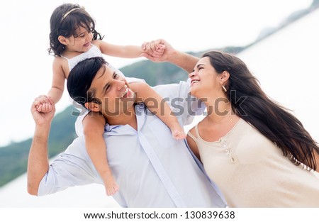 Loving Family Enjoying Their Time At The Beach